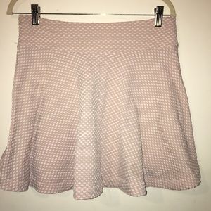 Light pink skirt, with white dots.